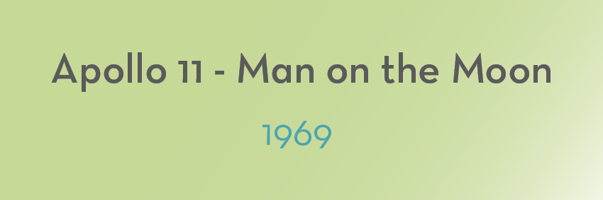 Text on a light green background reading "Apollo 11 - Man on the Moon" in large dark gray letters, with "1969" written below in smaller blue-green letters, commemorating one of the defining moments in history.