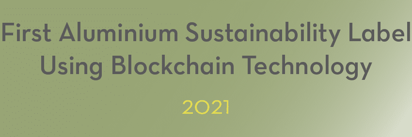 Text reads 'First Aluminium Sustainability Label Using Blockchain Technology, 2021' on a gradient green background, capturing innovative moments in aluminium.